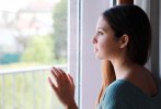 melancholic-sad-young-woman-looking-window-home-rainy-day-focus-model-eyes-indoor-photo-melanc...jpg